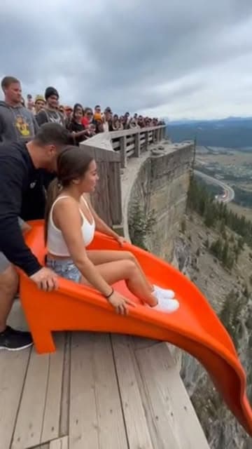 Picture this: a breathtaking mountain peak, kissed by the golden rays of the sun, standing tall against a canvas of endless blue sky. The air is crisp, filled with the scent of adventure and the thrill of the unknown. Now, imagine a figure standing at the edge, heart racing, adrenaline pumping, ready to embrace the wild call of freedom. 

Meet Alex, a fearless soul with a spirit as boundless as the horizon. With a deep breath, they take a moment to soak in the beauty around them—the jagged cliff